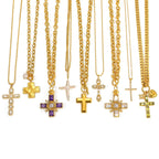 Cross pendant necklace assortment showing varied chain profiles and decorative accents