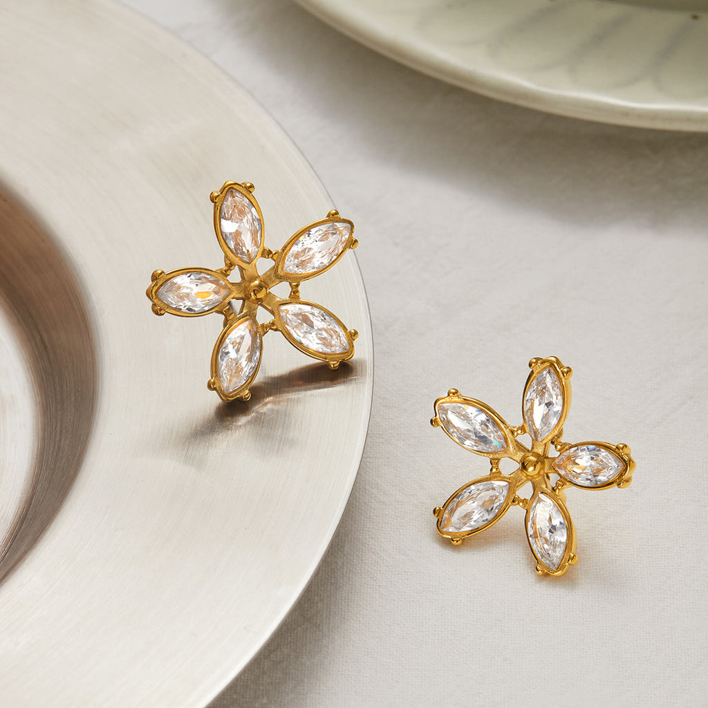 Five-petal clear stone earrings styled pair