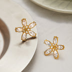 Five-petal clear stone earrings styled pair