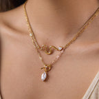 Toggle pendant and sculpted wave necklaces layered together