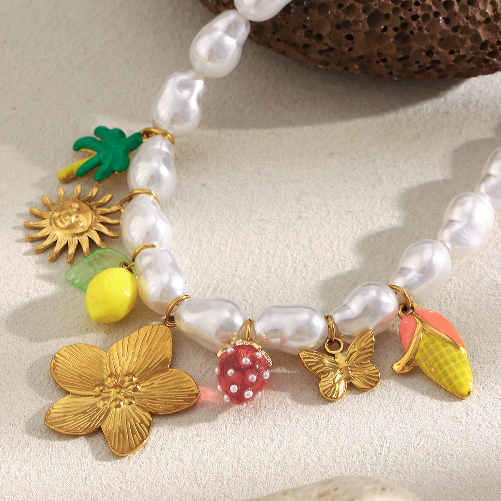 Close-up of flower strawberry butterfly and palm-tree charms