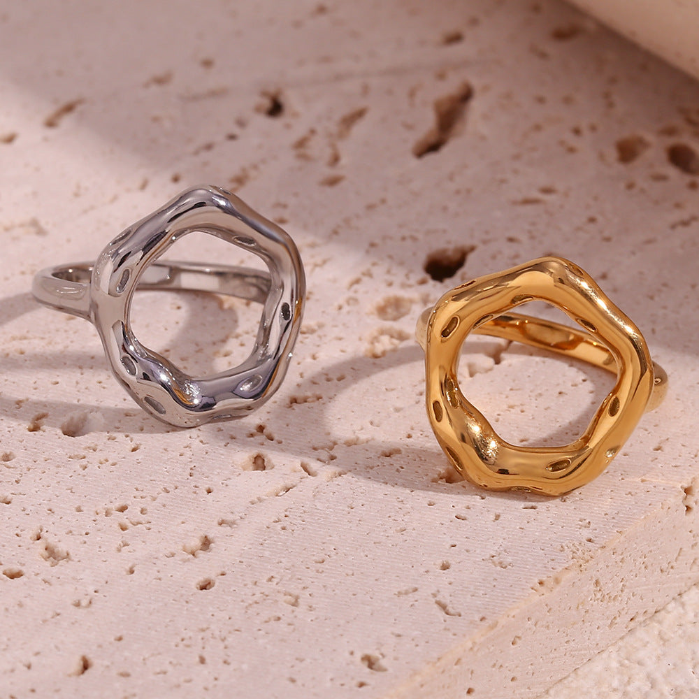 front view of gold and silver irregular open-center rings
