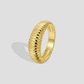 isolated gold plated brass ribbed dome band ring