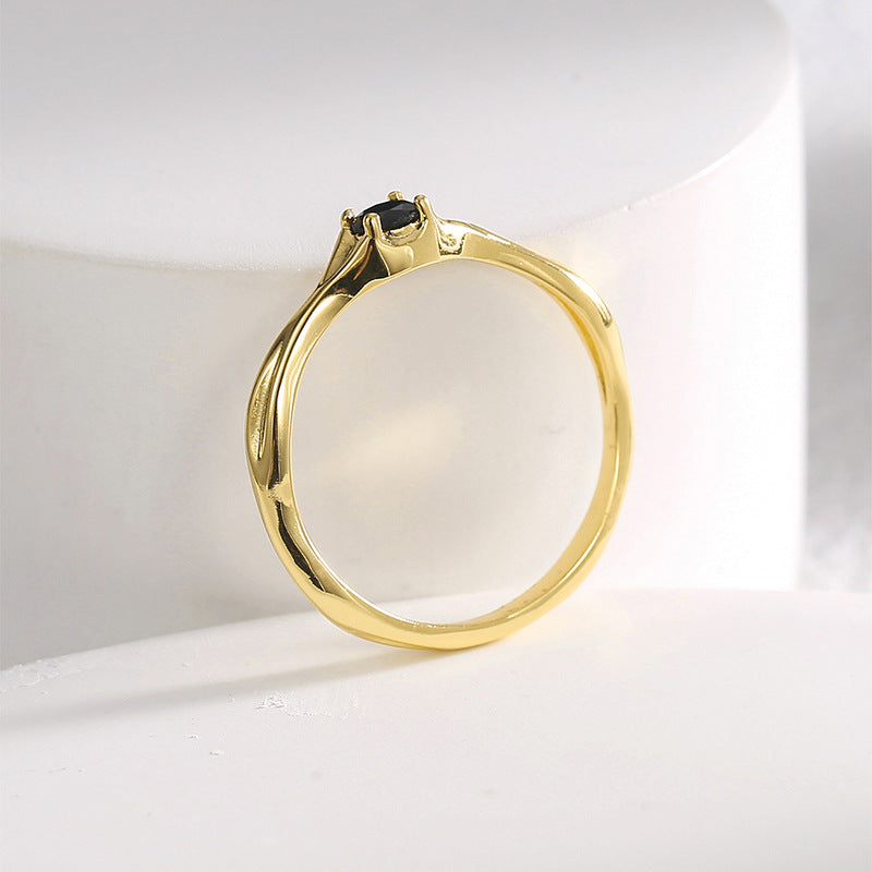rear view of black stone ring showing the four-prong setting