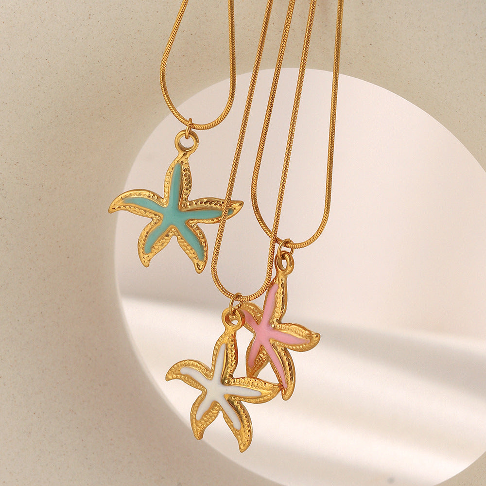 Enamel starfish pendant necklaces styled in pink aqua and ivory