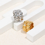 gold and silver wide band rings with scattered clear accents