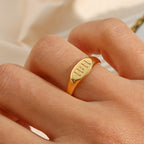 model wearing the gold plated stainless steel 11:11 signet ring