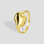 isolated gold plated sculptural lotus leaf statement ring