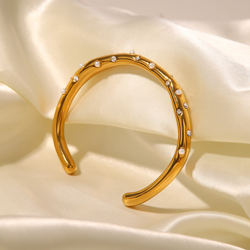 Gold Plated Stainless Steel Wavy Pearl and Clear Stone Cuff Bracelet — worn view