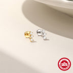 Gold finish and silver-tone three-stone flat-back studs