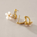 Flower earrings showing their stud posts and curved backs