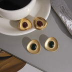 gold plated resin cabochon earrings styled in two color options
