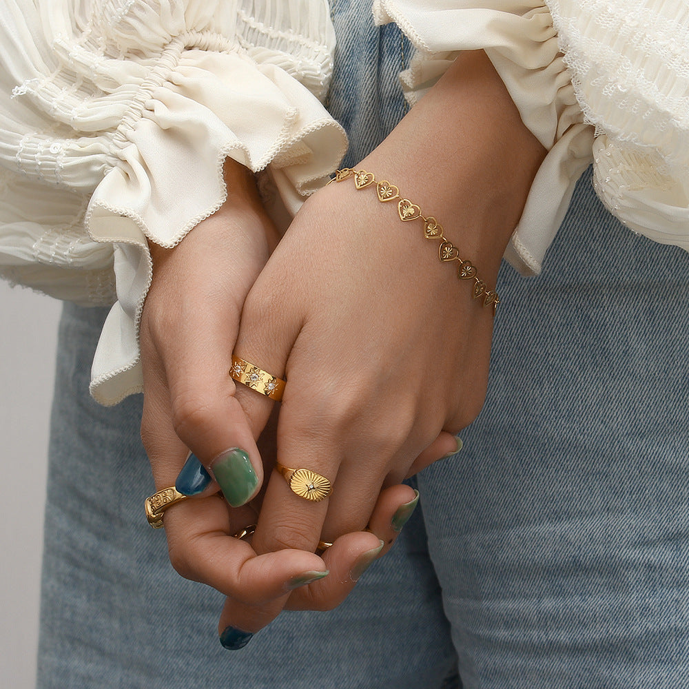 gold plated open heart bracelet styled on the wrist