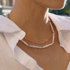 Two-necklace set with paperclip links and long white beads worn together