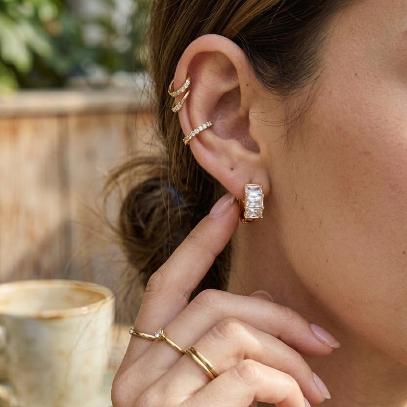 Three-stone hoop earring styled with separate ear cuffs