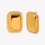 isolated front and side view of pearl-trimmed gold dome studs