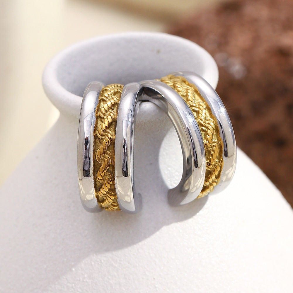 two-tone stainless steel C-hoops with a braided gold center