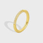 front view of slim gold plated brass ring with three zirconia rows