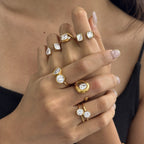 Different paired-stone and open ring designs worn together