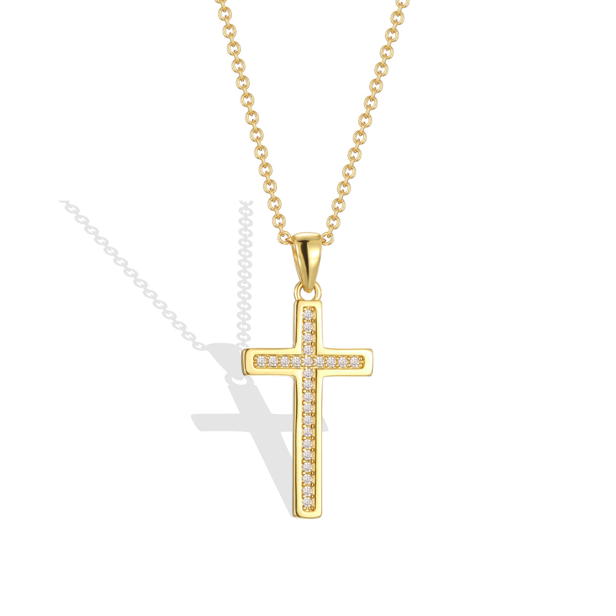 isolated gold plated cross pendant with clear stone channel