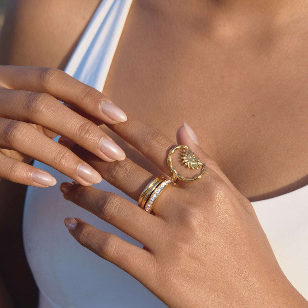 sculptural celestial sun ring in a layered ring look