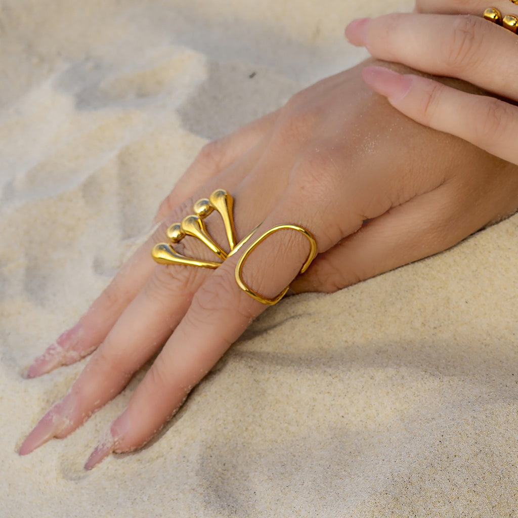 Gold-Tone Stainless Steel Sculptural Flower Ring Collection — styled view