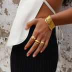 Textured pearl-look ring styled with other jewelry