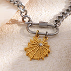 Close-up of sunburst pendant and screw clasp