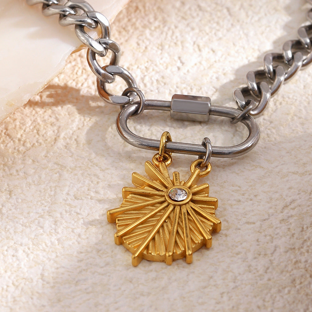 Close-up of sunburst pendant and screw clasp