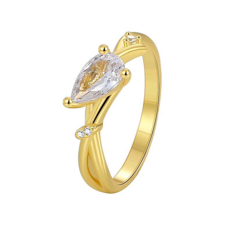isolated pear-cut clear stone bypass ring on white
