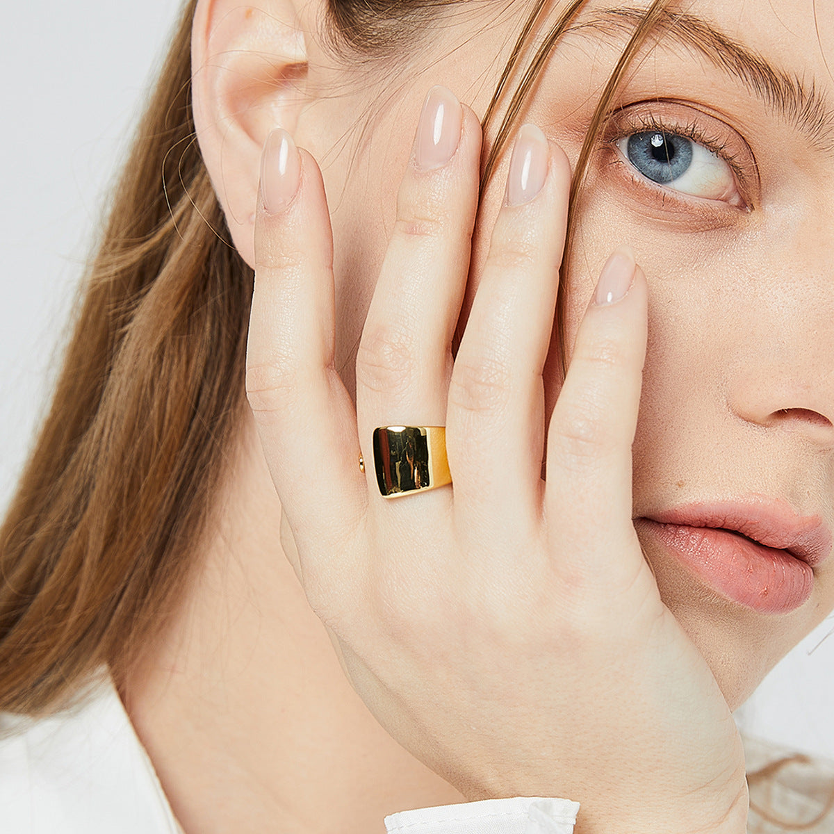 wide polished foldover open ring worn on the hand