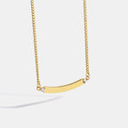 gold plated brass curved bar necklace with clear end stones
