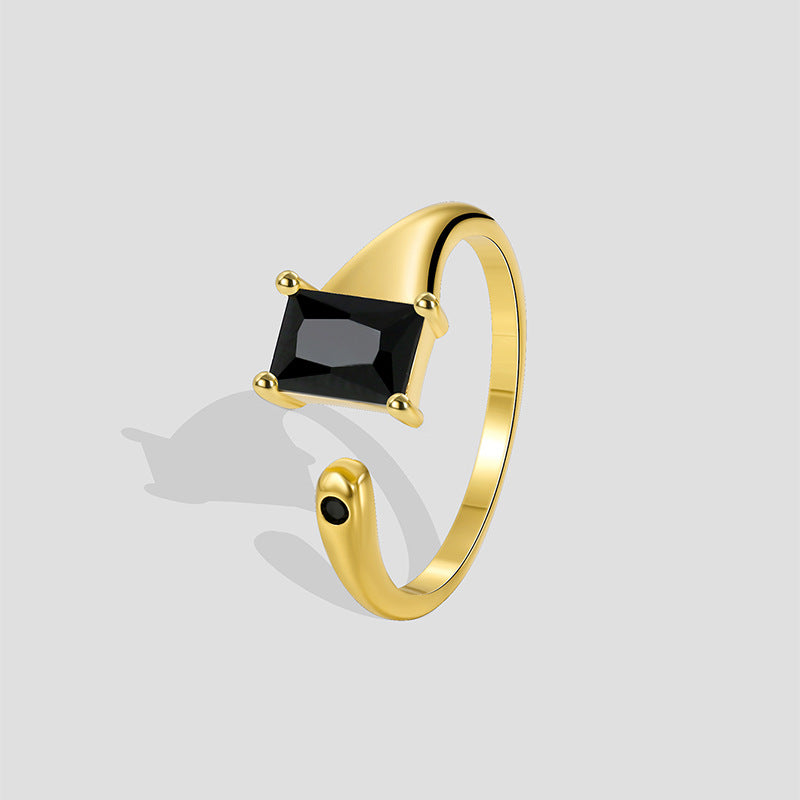 gold plated brass open ring with rectangular black stone and round accent
