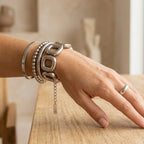 Square-link bracelet layered on the wrist
