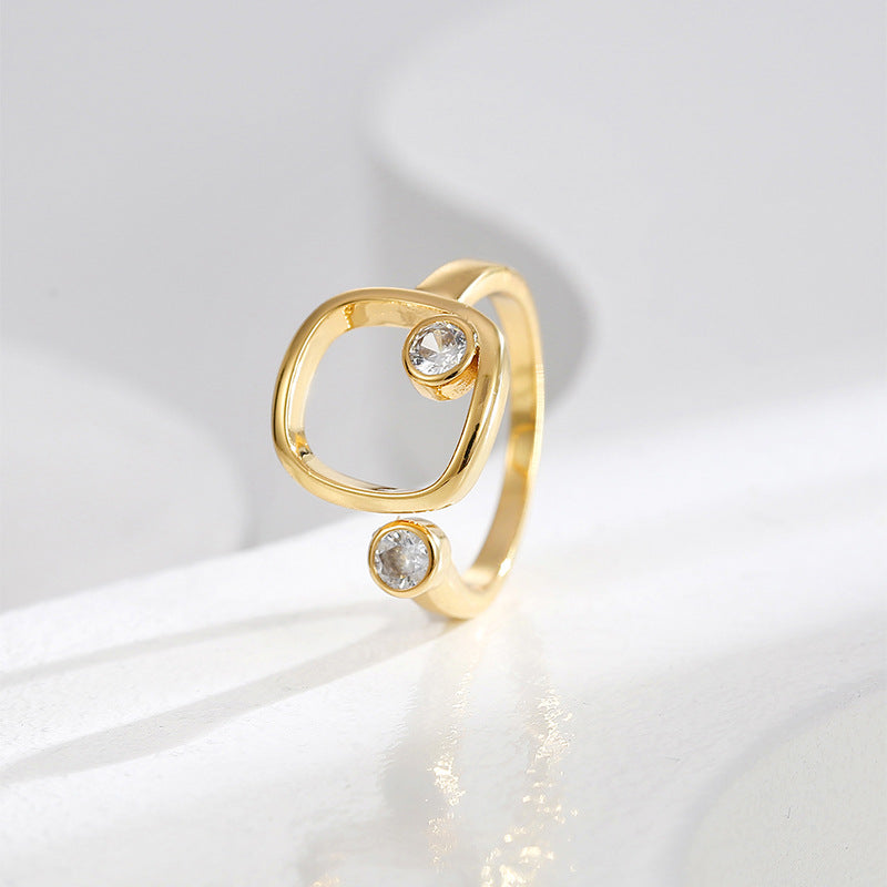 upright side view of the asymmetric two-stone open ring