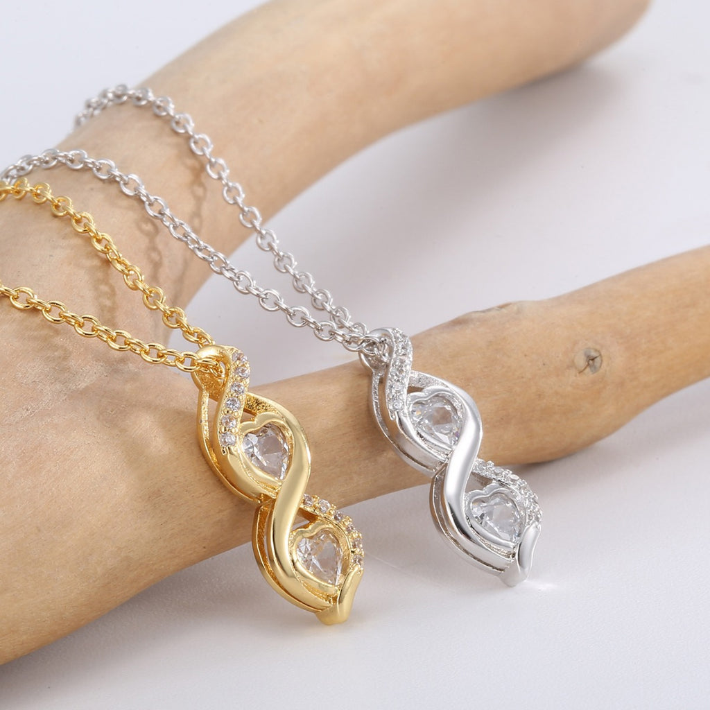 side view of the double-twist frame around two round clear stones