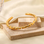 Gold Plated Stainless Steel Wavy Pearl and Clear Stone Cuff Bracelet — front view