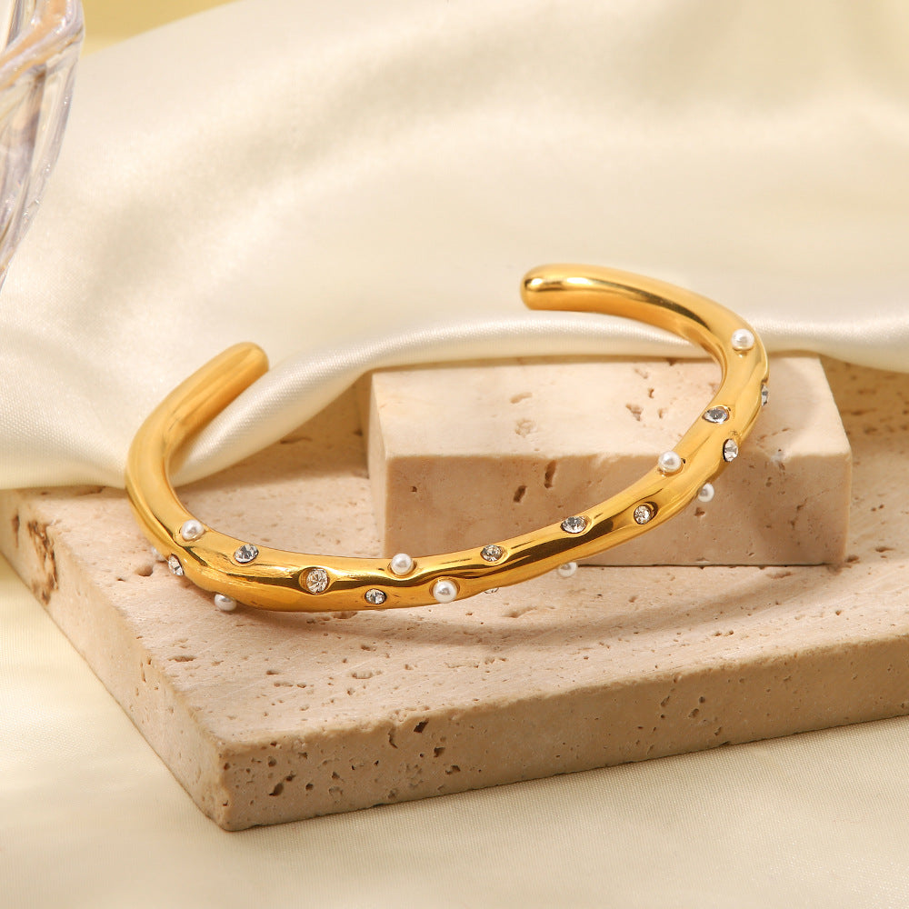 Gold Plated Stainless Steel Wavy Pearl and Clear Stone Cuff Bracelet — front view