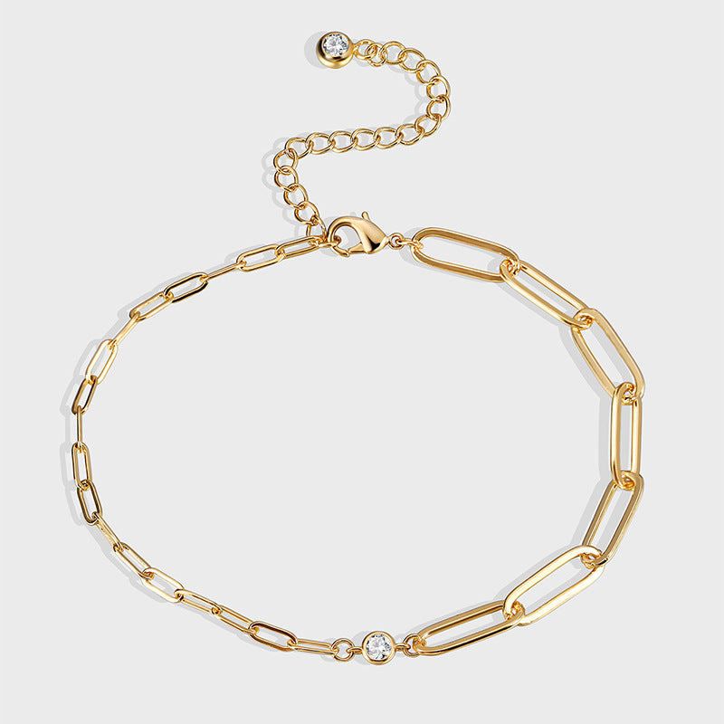 gold plated asymmetrical paperclip anklet with clear stones