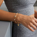 Mixed-cut heart bracelet layered on a wrist