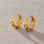 Hoop pair showing hinged posts and scattered white beads