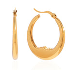 isolated pair of gold plated wavy oval hoop earrings