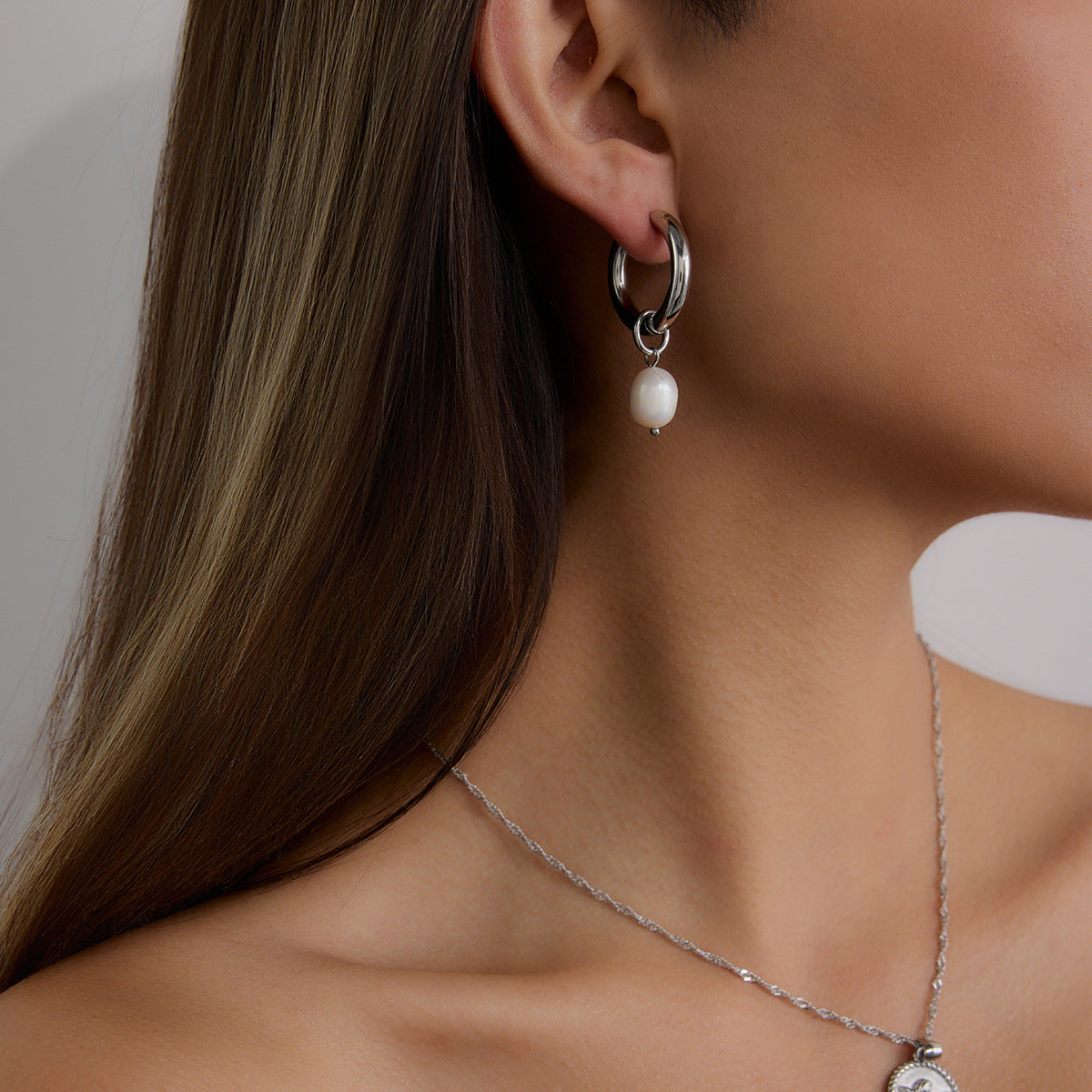 Silver-Finish Pearl-Look Stainless Steel Drop Hoop Earrings – styled view