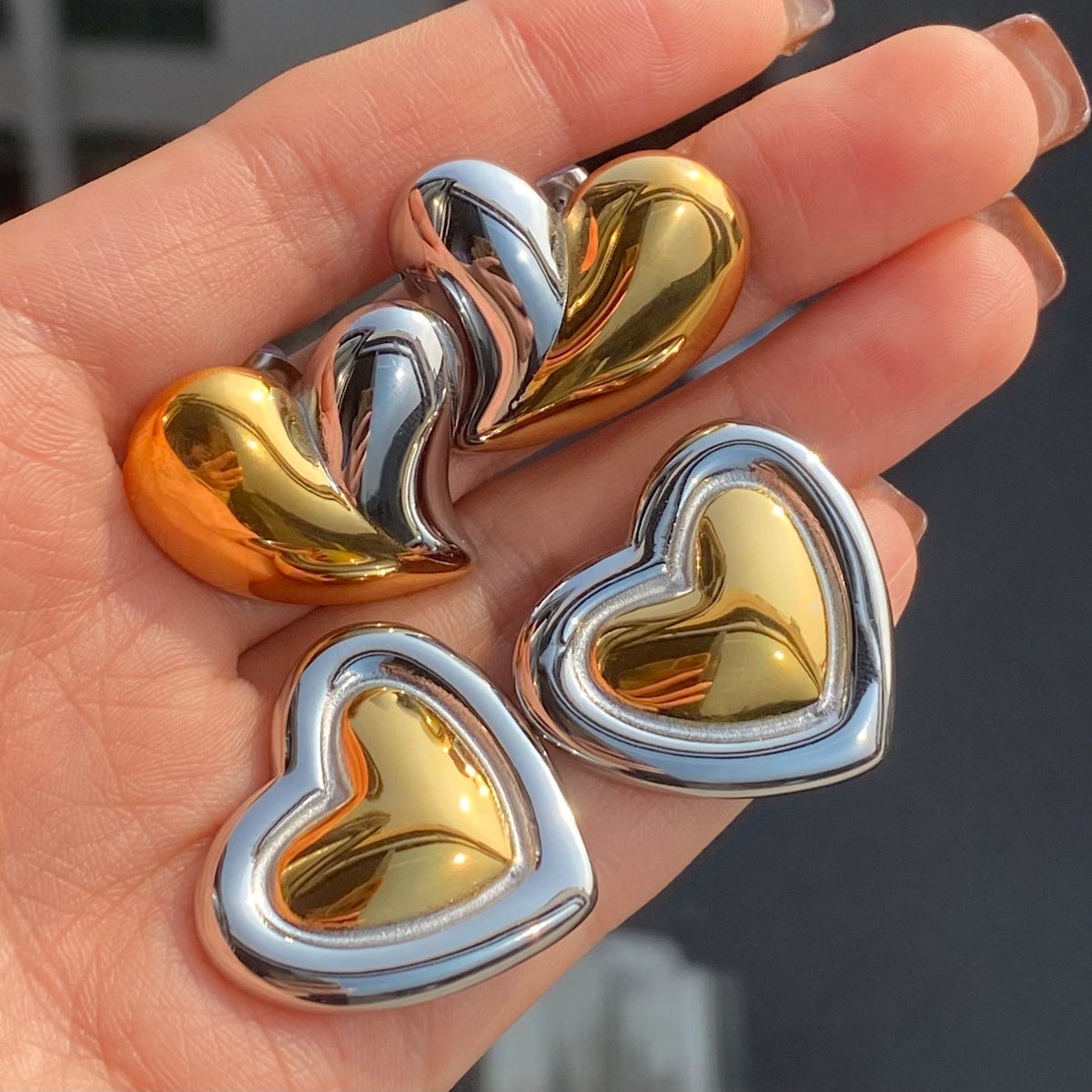Wholesale Stainless Steel Heart Stud Earring Collection in Mixed Finishes - styled view