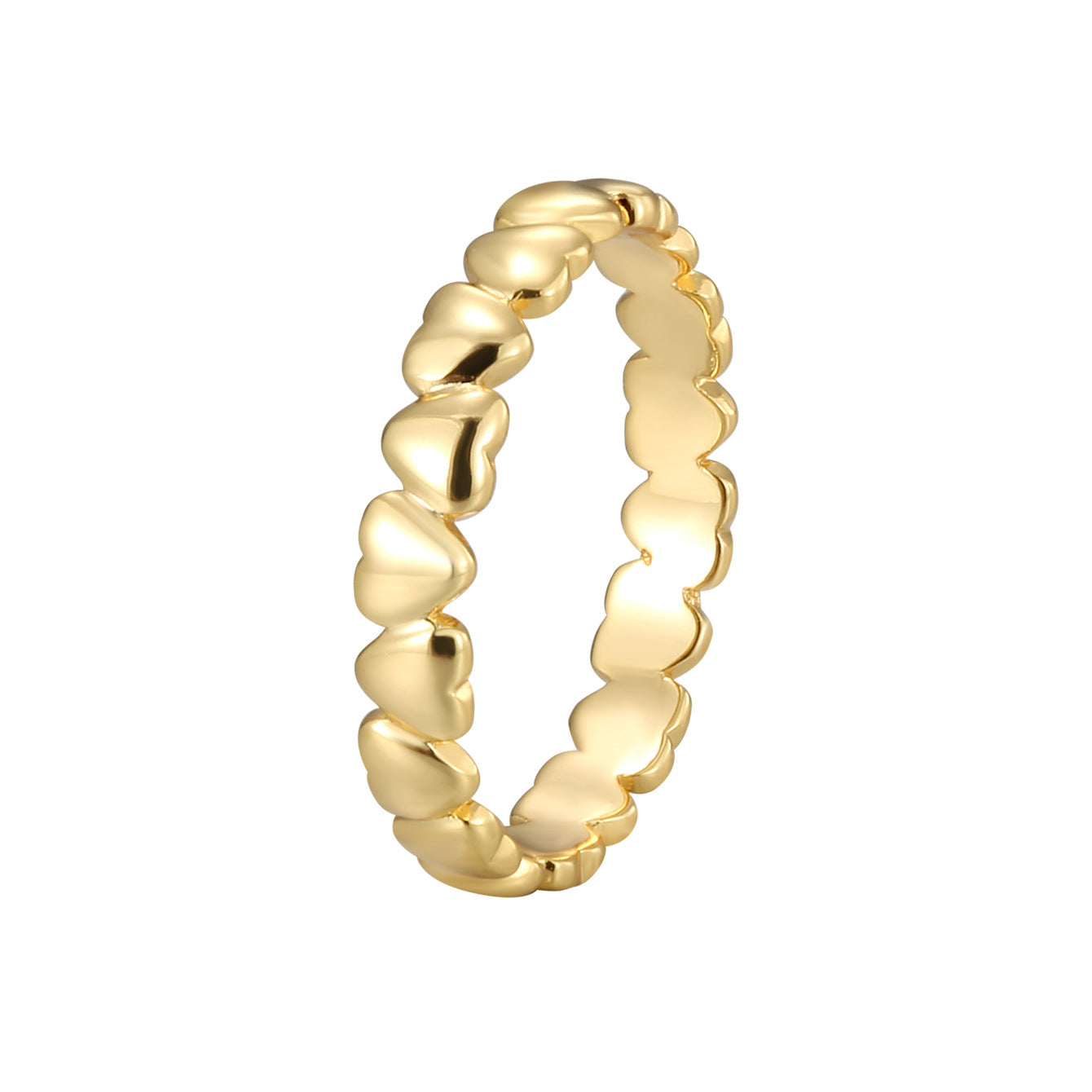 isolated gold plated brass heart band ring on white