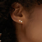 graduated square clear stone stud earring worn on the lobe