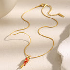 Red scale fish necklace laid out with its extender