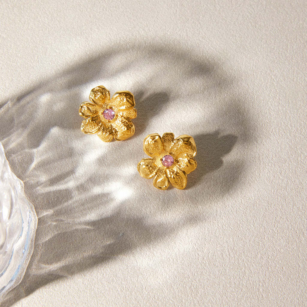 Pair of flower earrings with raised petals