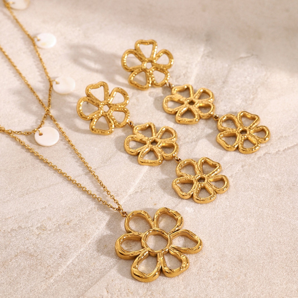 Triple open-flower drop earrings beside separate floral necklace references