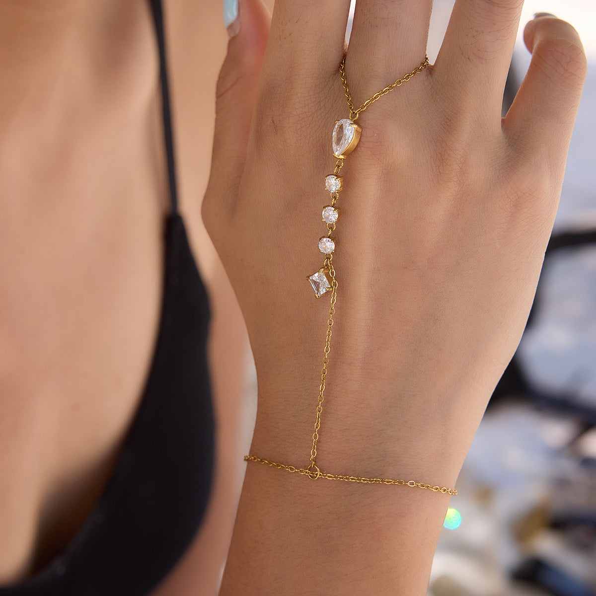 Close-up of clear stones along a hand chain